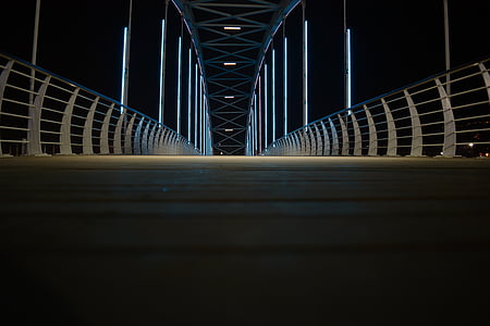 gray and white metal bridge during night time