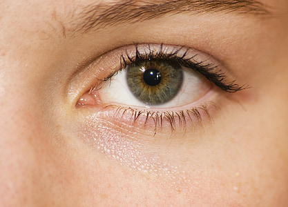 green human eyes closeup photography