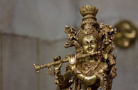 brown Krishna figure in tilt-shift lens photography
