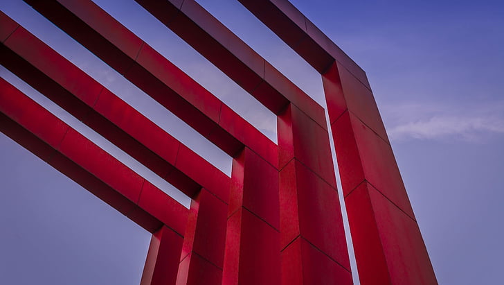 low-angle photography of five red arch gateway