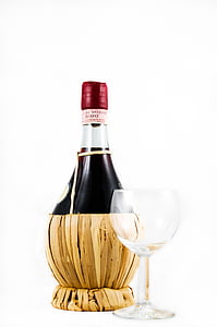 empty wine glass near wine bottle