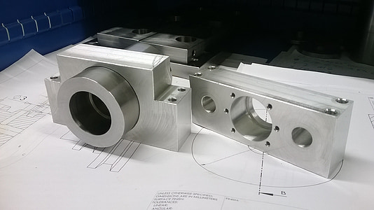 rectangular gray metal tool on white printing paper