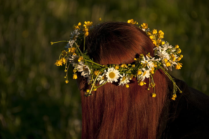 woman wearing yellow ox-eyed daisy headress