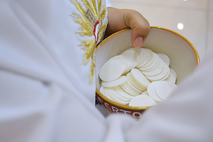 selective focus of holy host in bowl