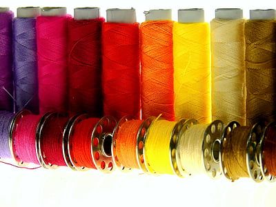 assorted-color threads with spools
