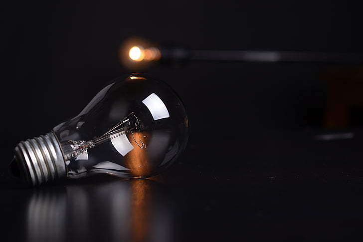 selective focus photography of clear incandescent light bulb