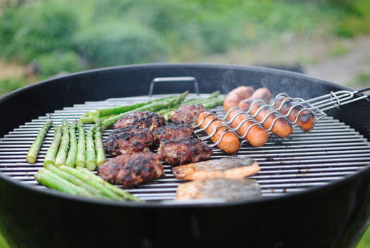 close-up photo of grilled meats and sausages on gas grill