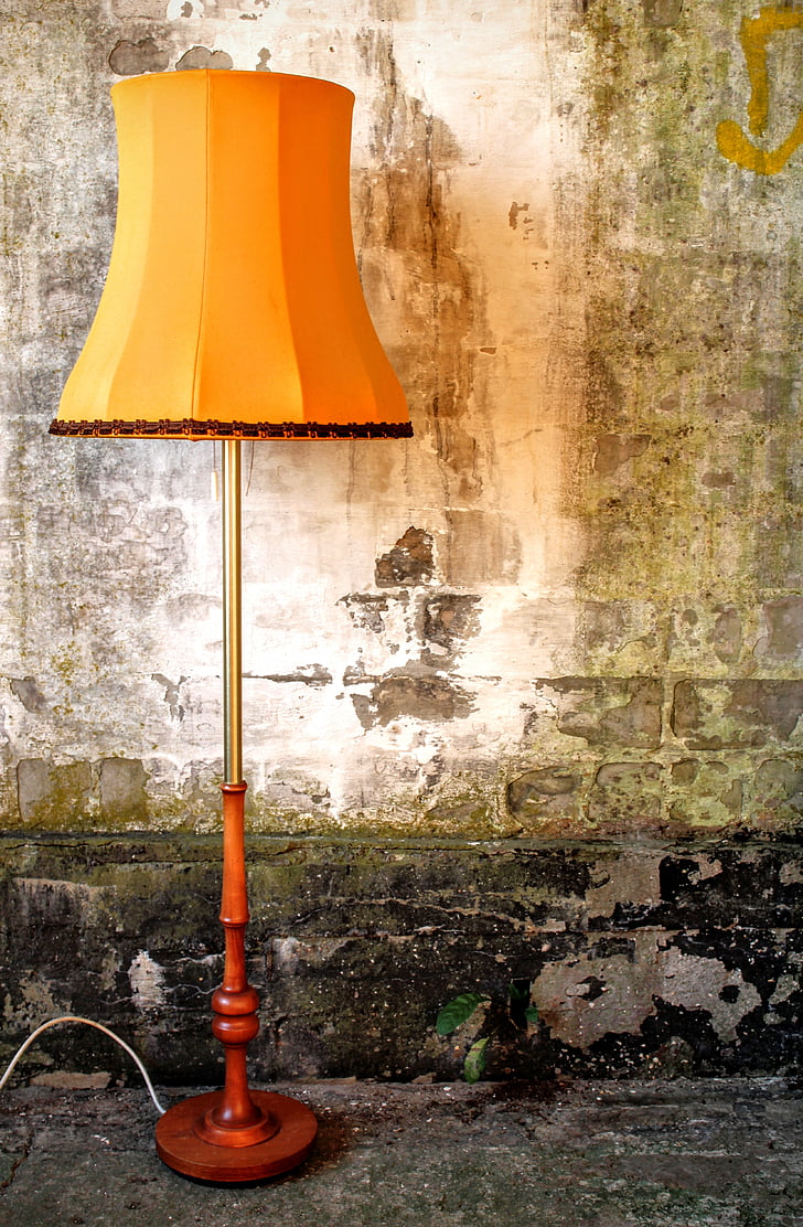 brown and orange shade table lamp on floor