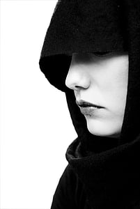 woman with cape grayscale photo