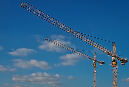 two crane tower under clear blue sky
