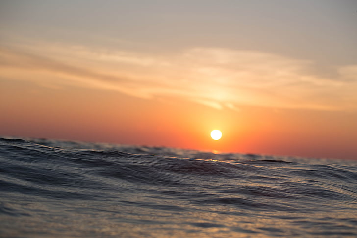 ocean waves under sunset