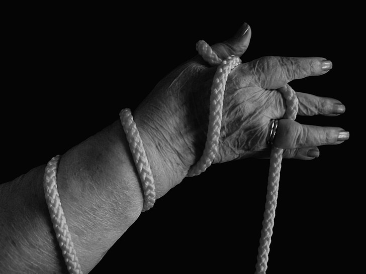 grayscale photo of woman holding rope