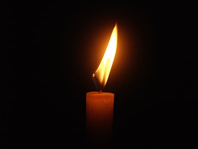 lighted taper candle