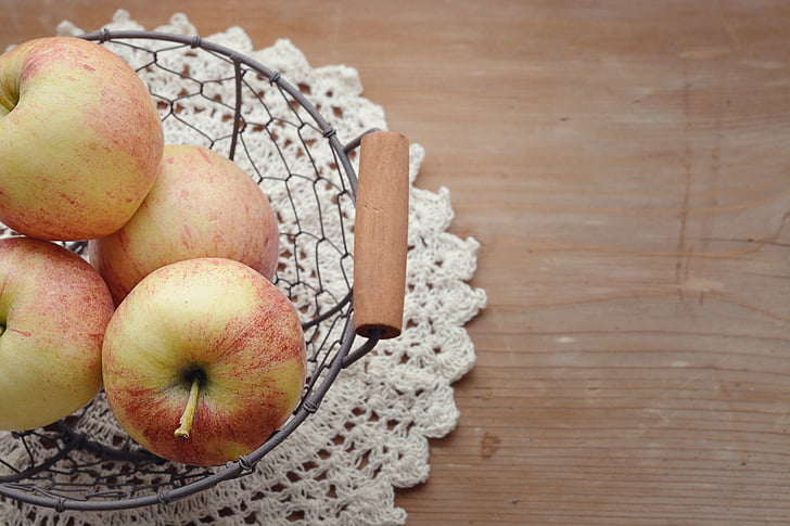 apples on gray basket