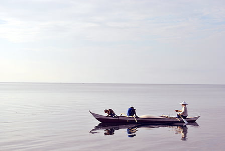 three people on boat