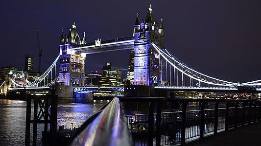 photo of lighted tower bridge during night time