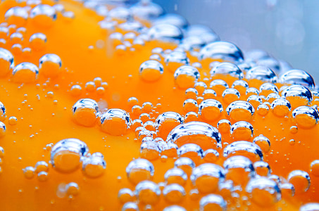 close photography of orange liquid