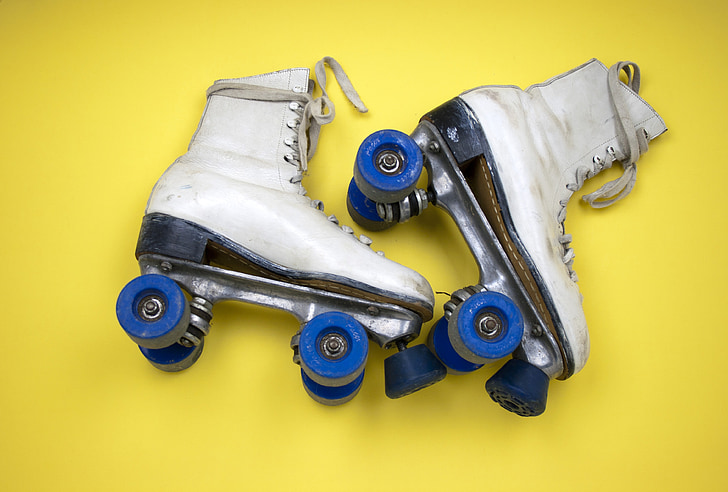 pair of white leather roller skates