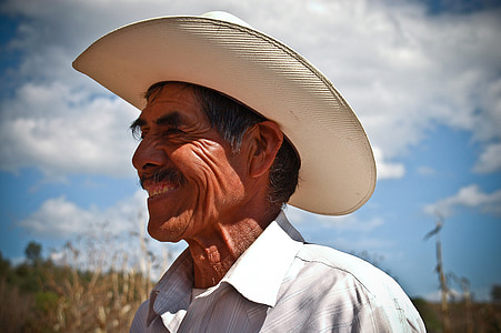 shallow focus photography of man wearing white ten-gallon hat