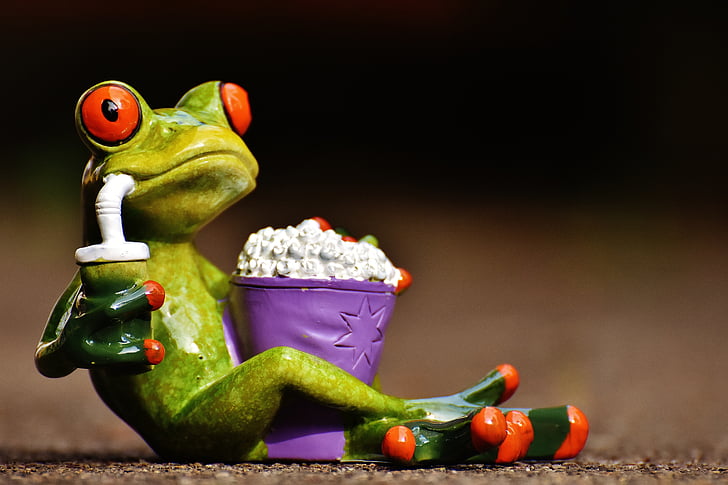 frog sipping juice with popcorn ceramic figurine