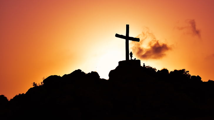 silhouette photo of cross on mountain