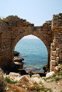 arch-shape bricks gate near seashore