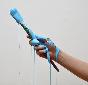 person holding paint brush