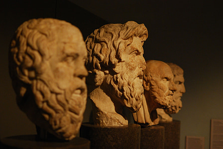 photo of four men head busts