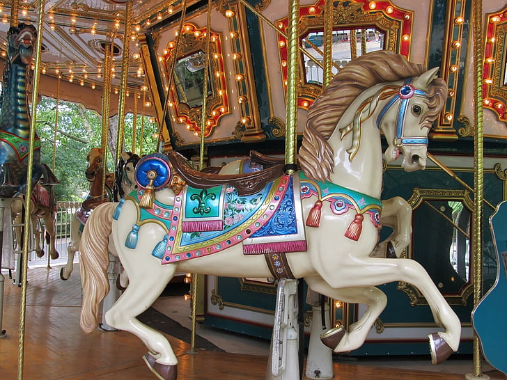 white, blue, and brown horse carousel