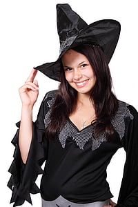 smiling woman wearing witch hat and v-neck top