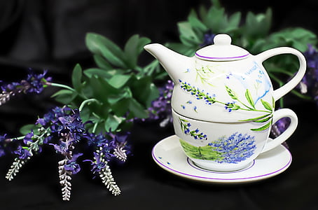 Turkish teapot beside the purple petaled flower