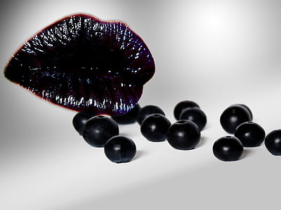 photo of black lips and berries