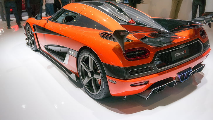 orange and black sports coupe inside room