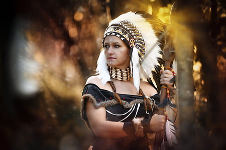 shallow focus photograph of woman in native American costume