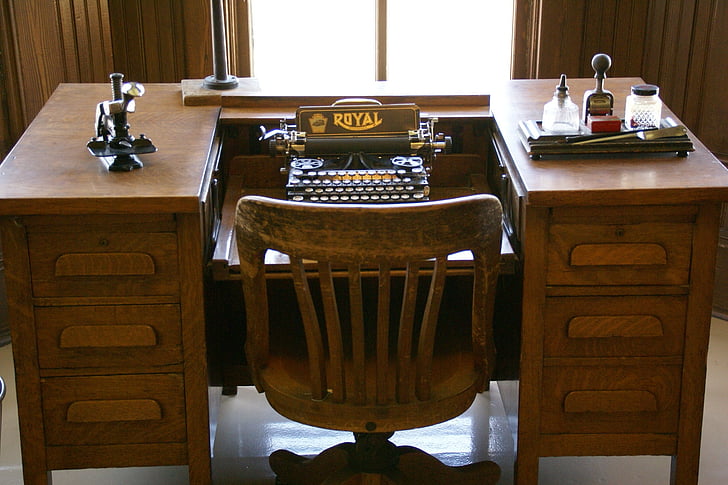 typewriter on brown wooden desk