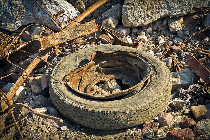 rusted vehicle wheel with tire