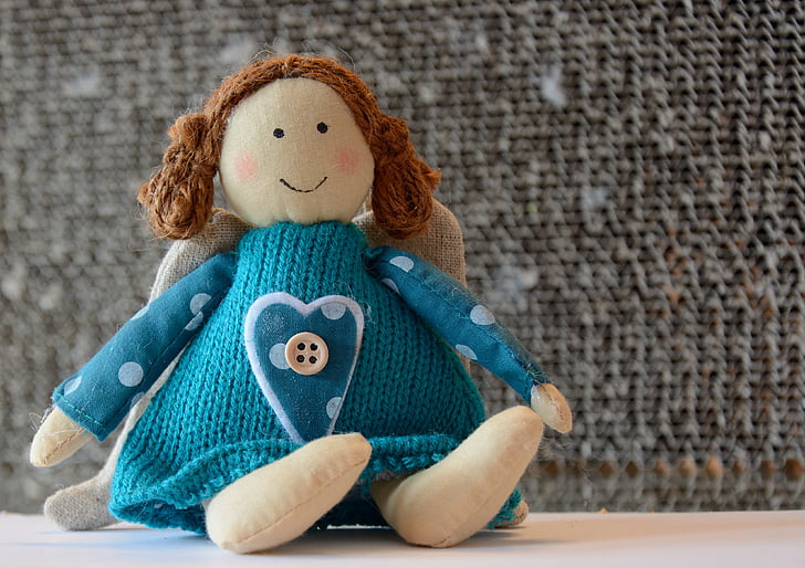 teal knitted doll