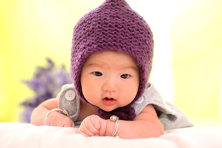 baby wearing purple knitted chulo and gray top