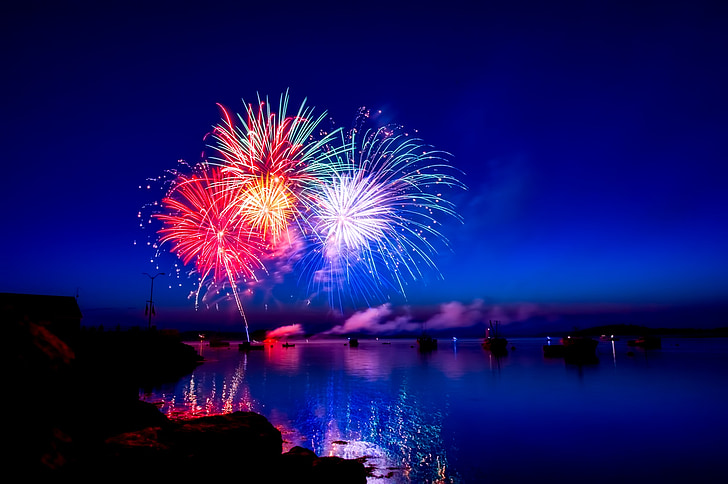 fireworks over body of water