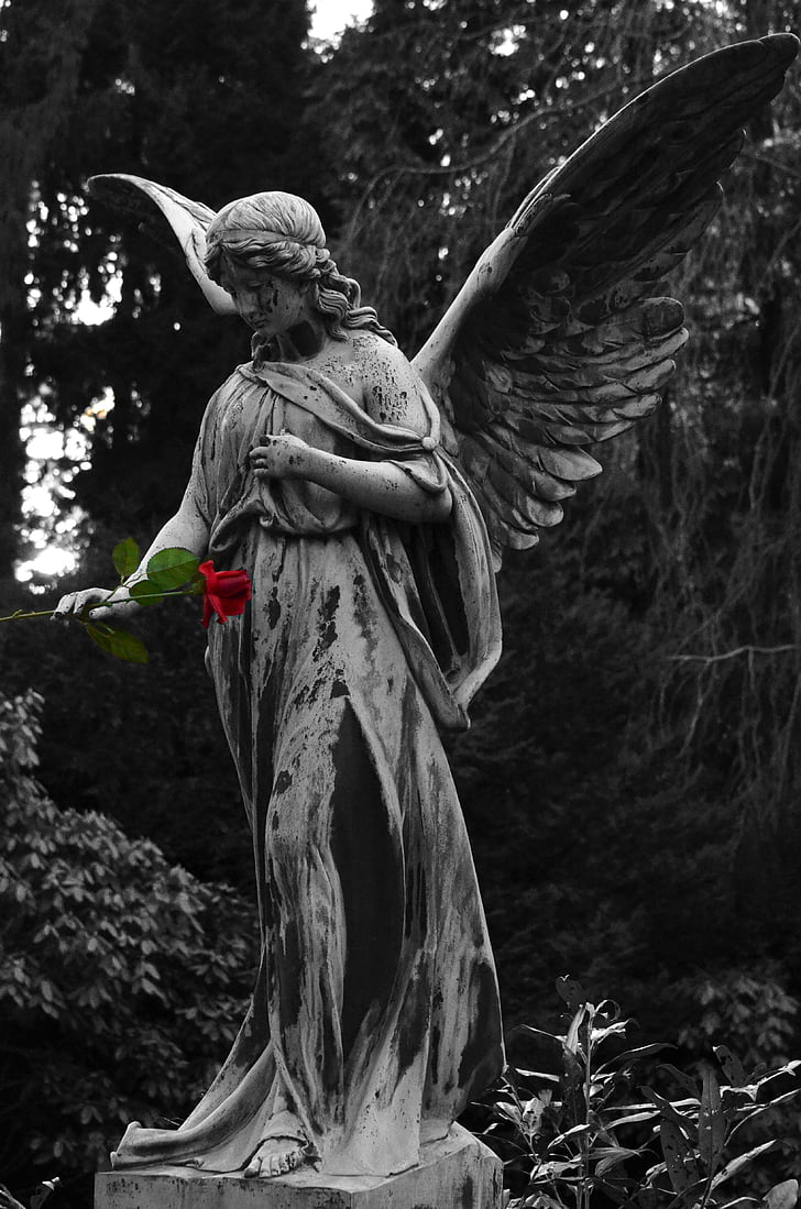 angel statue holding rose flower