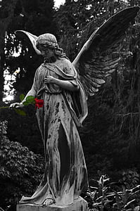 angel statue holding rose flower