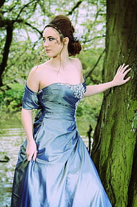 woman in blue cold-shoulder dress