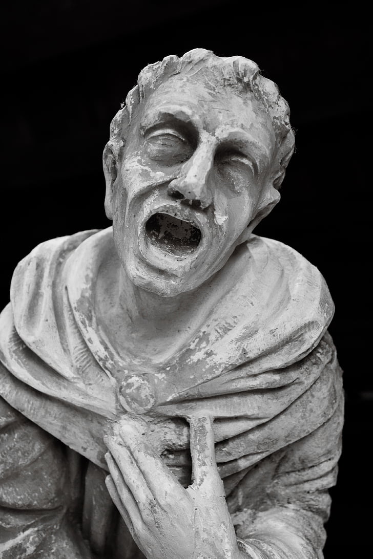 stone statue of screaming man