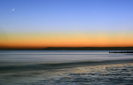 photograph of sea during golden hour