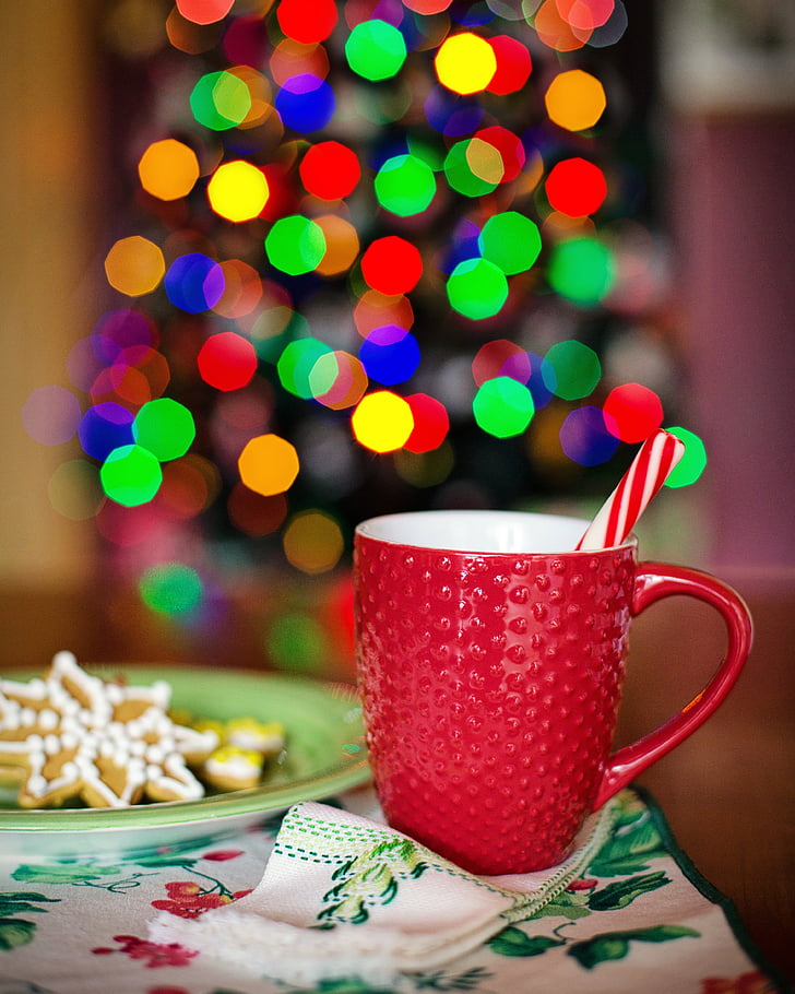 selective focus photo of red mug with candy cane