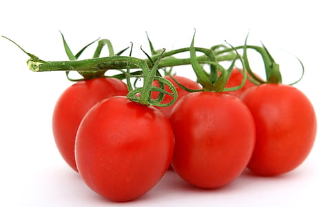 closeup photo of six red tomatoes
