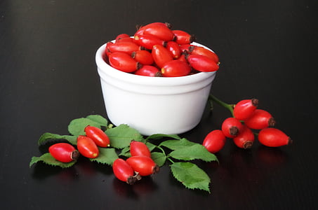 red fruit on white bowl