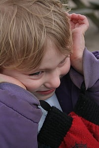 photographed of child in purple jacket