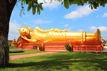 gold-colored sleeping Buddha statue