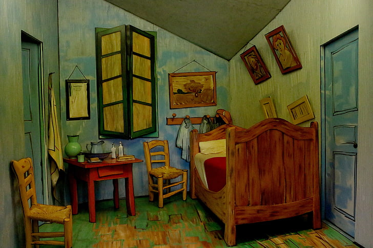 brown bed and red table with chairs painting